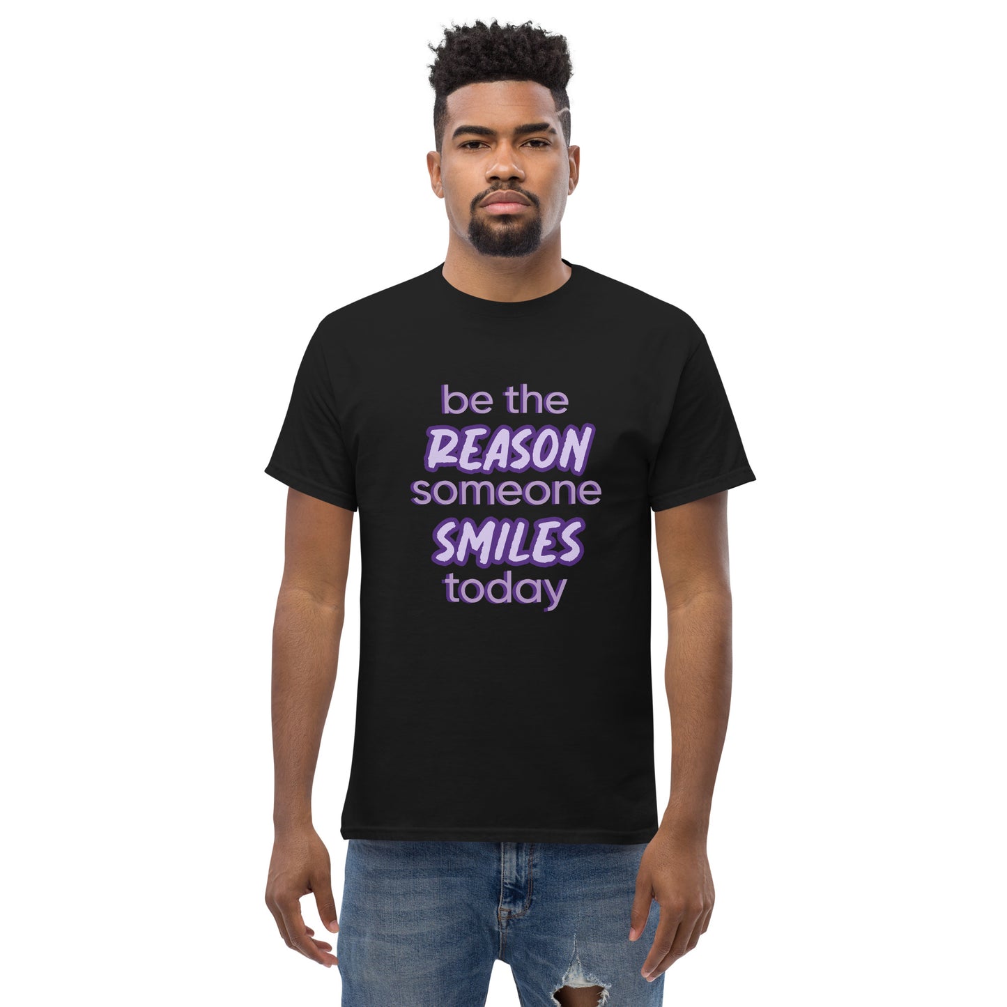 Men with black T-shirt and the quote "be the reason someone smiles today" in purple on it.