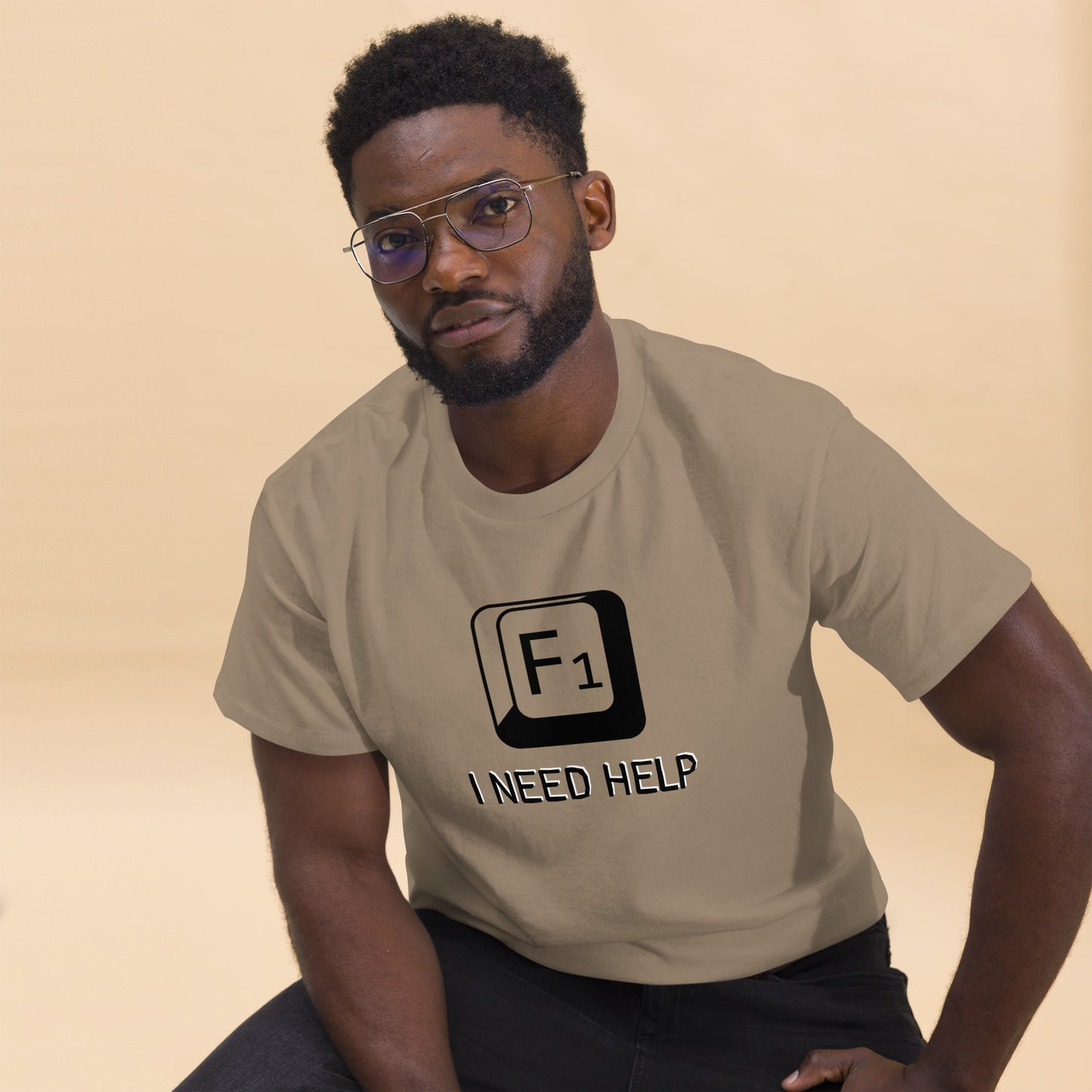 Men with Brown savana T-shirt and a picture of F1 key with text "I need help"