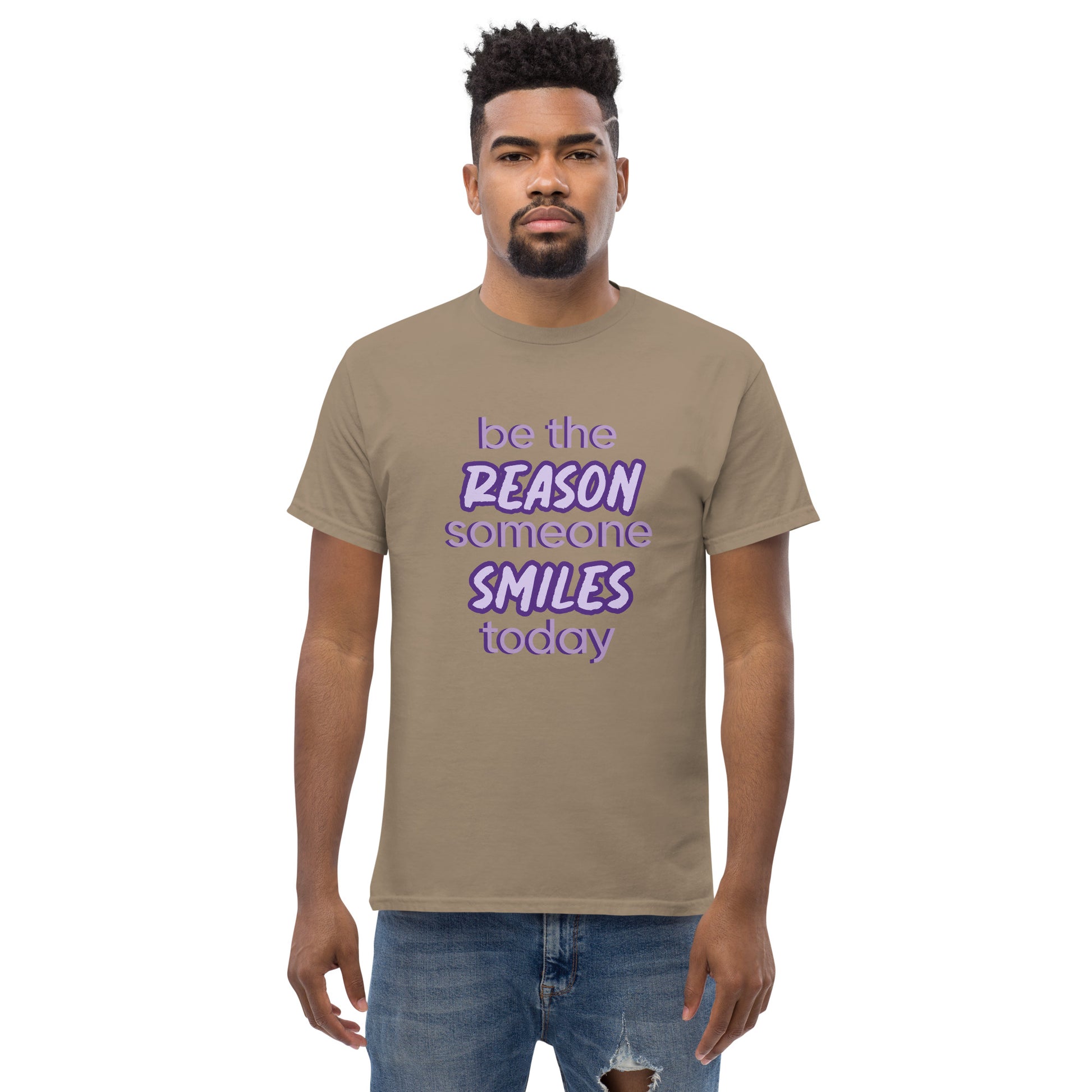 Men with brown savana T-shirt and the quote "be the reason someone smiles today" in purple on it. 