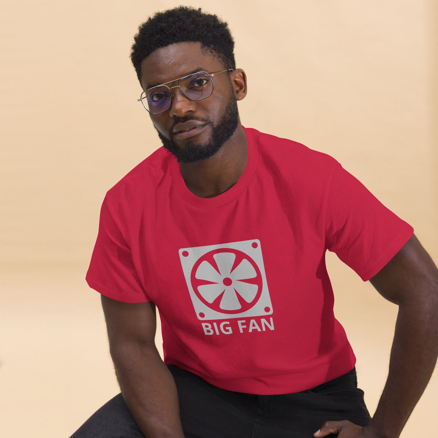 Man with cardinal red t-shirt with image of a big computer fan and the text "BIG FAN"