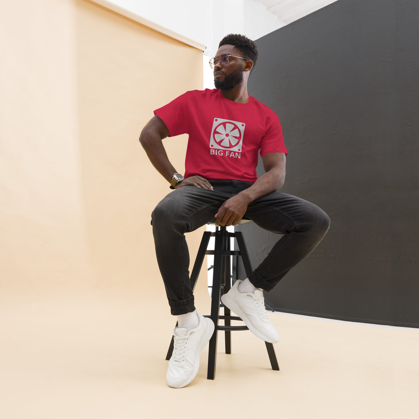 Man with cardinal red t-shirt with image of a big computer fan and the text "BIG FAN"