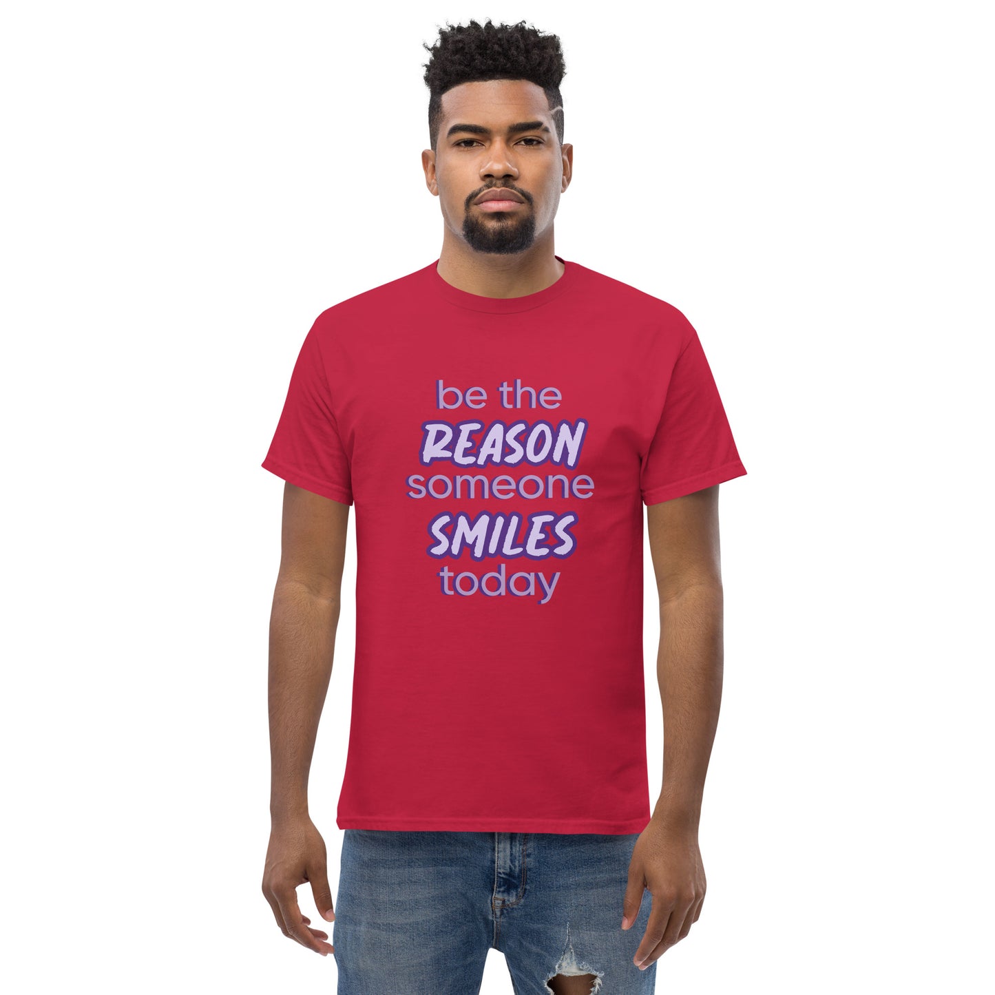 Men with cardinal T-shirt and the quote "be the reason someone smiles today" in purple on it.