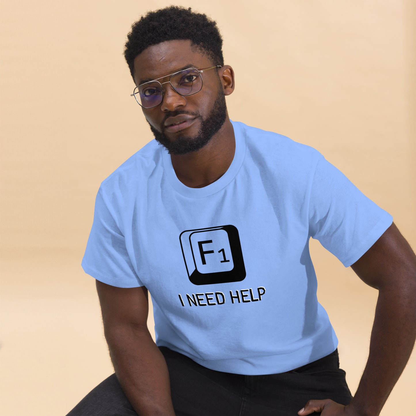 Men with Carolina blue T-shirt and a picture of F1 key with text "I need help"