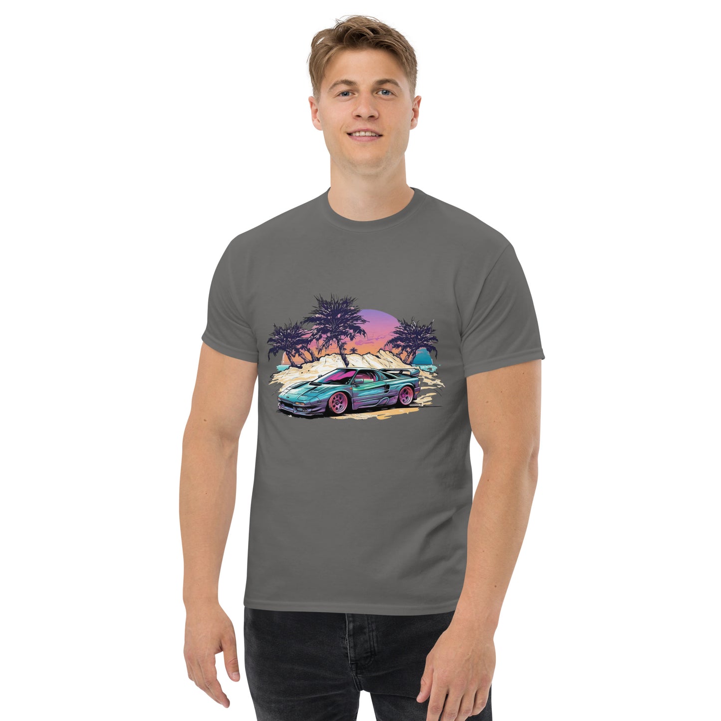 man with grey t-shirt with picture of vintage car in front of palm trees