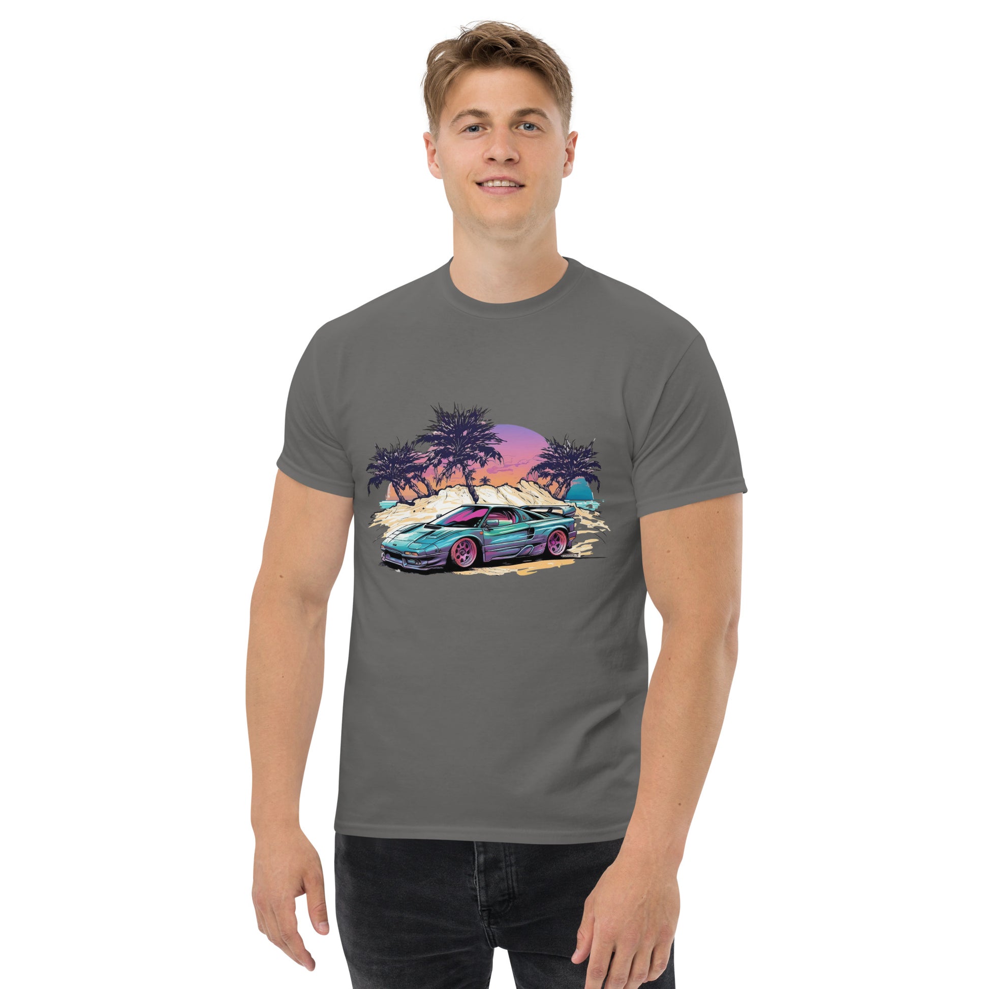 man with grey t-shirt with picture of vintage car in front of palm trees 