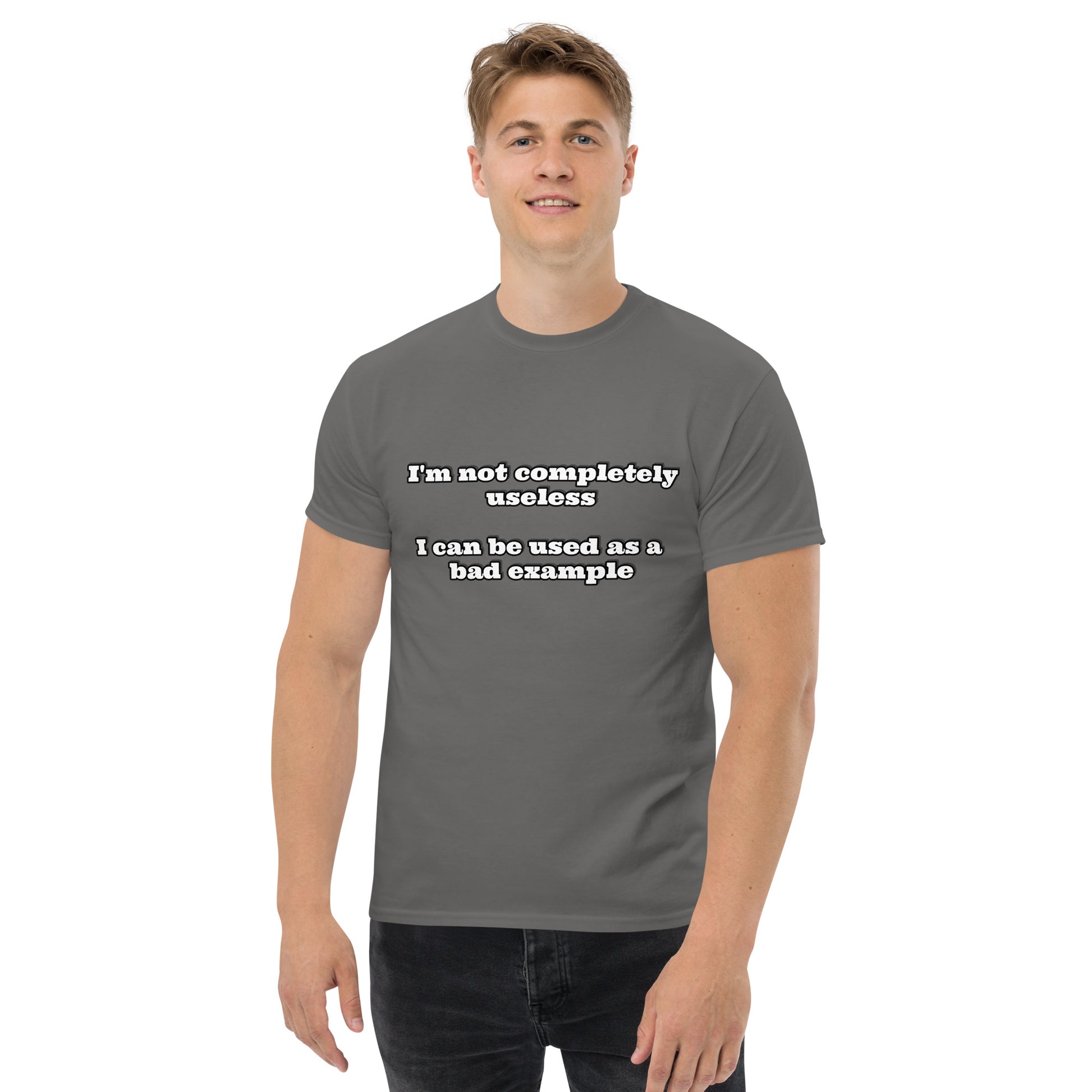 Men with charcoal t-shirt with text “I'm not completely useless I can be used as a bad example”