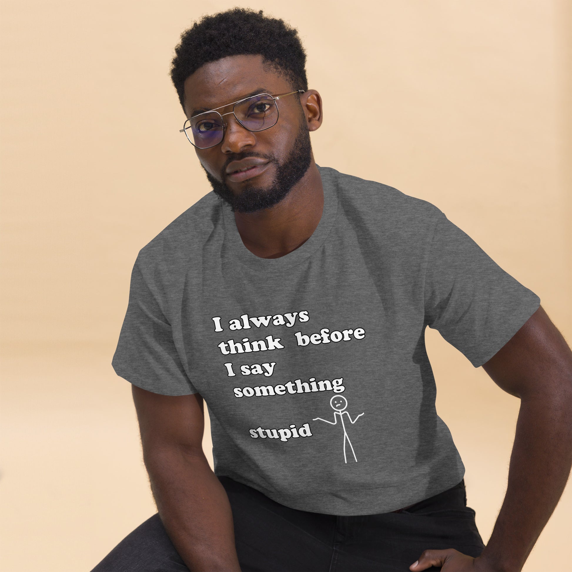 Man with grey t-shirt with text "I always think before I say something stupid"