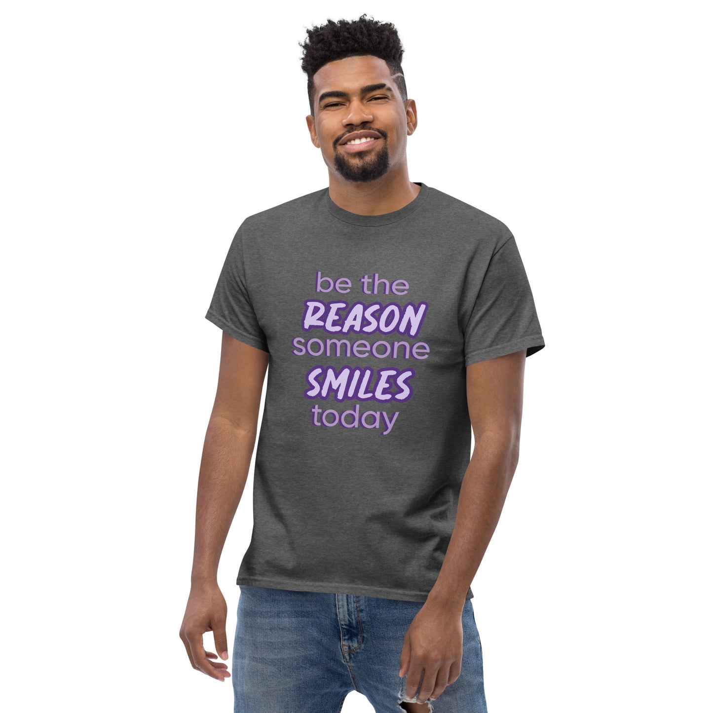 Men with dark grey T-shirt and the quote "be the reason someone smiles today" in purple on it.