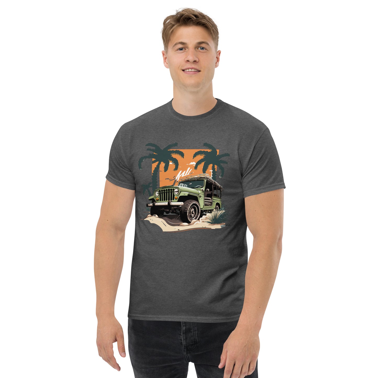 man with dark grey t-shirt with picture of jeep in front of palm trees 