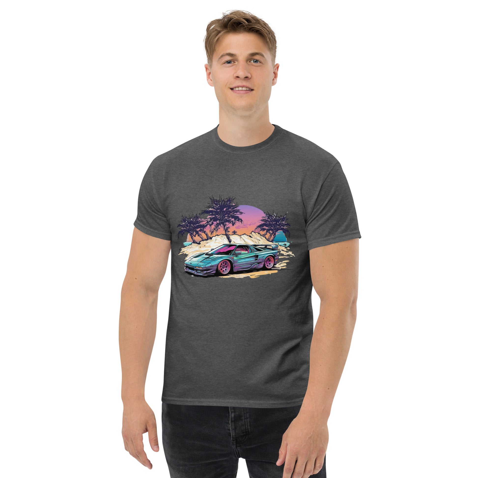 man with dark grey t-shirt with picture of vintage car in front of palm trees 