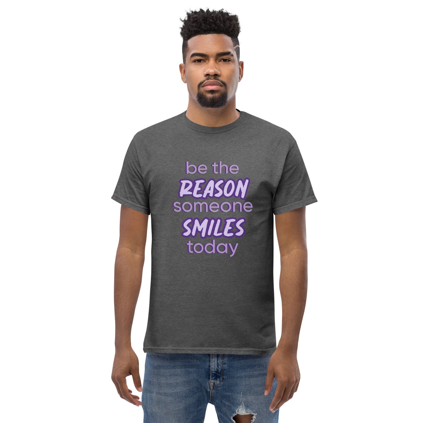 Men with dark grey T-shirt and the quote "be the reason someone smiles today" in purple on it.