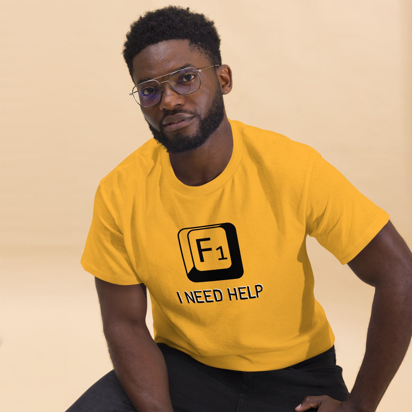 Men with Gold T-shirt and a picture of F1 key with text "I need help"