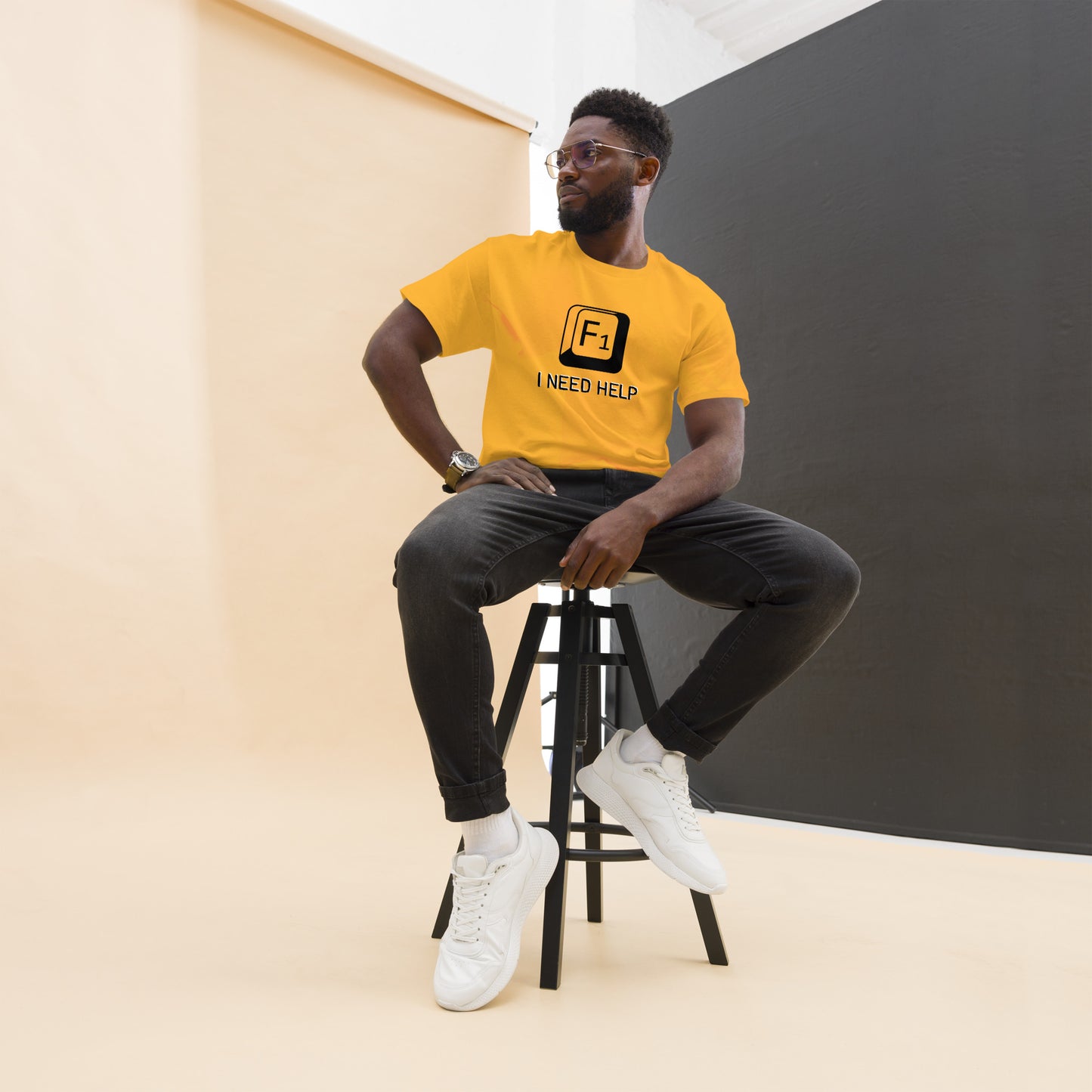 Men with Gold T-shirt and a picture of F1 key with text "I need help"