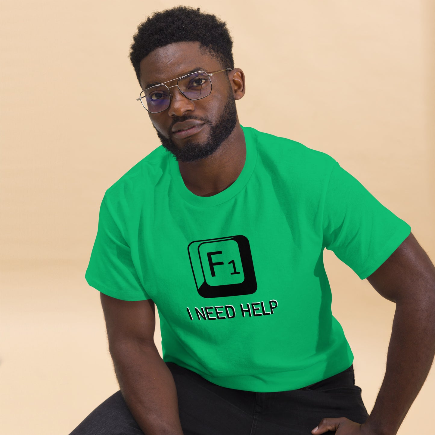Men with Irish green T-shirt and a picture of F1 key with text "I need help"