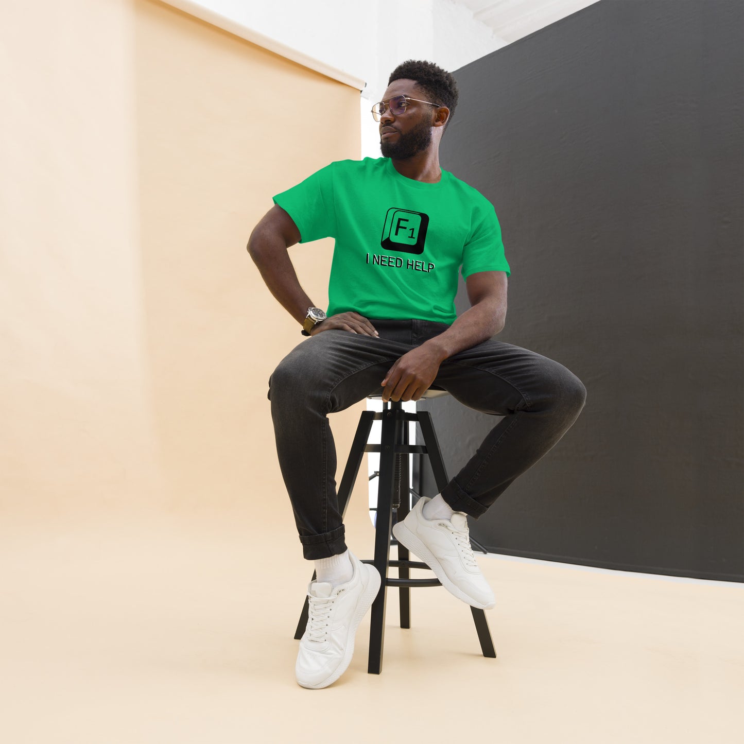 Men with Irish green T-shirt and a picture of F1 key with text "I need help"