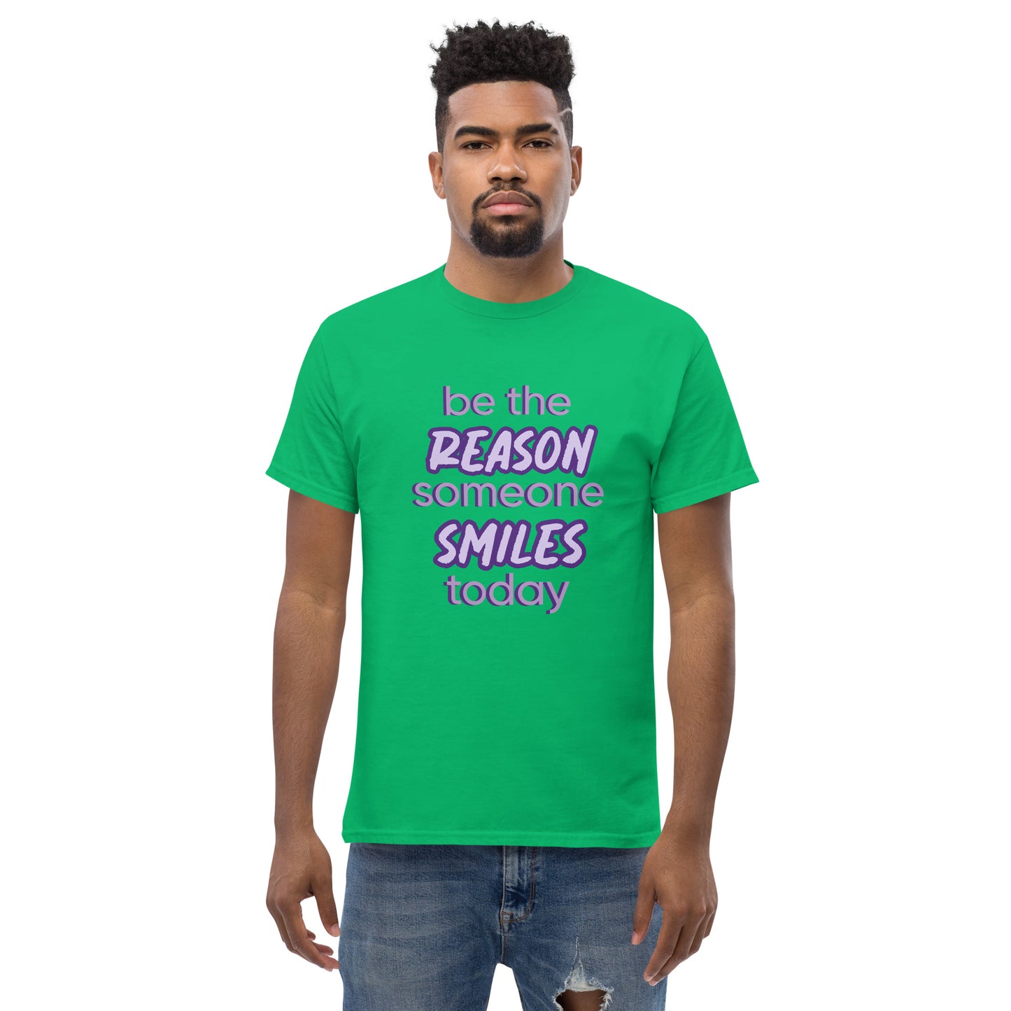 Men with irish green T-shirt and the quote "be the reason someone smiles today" in purple on it.