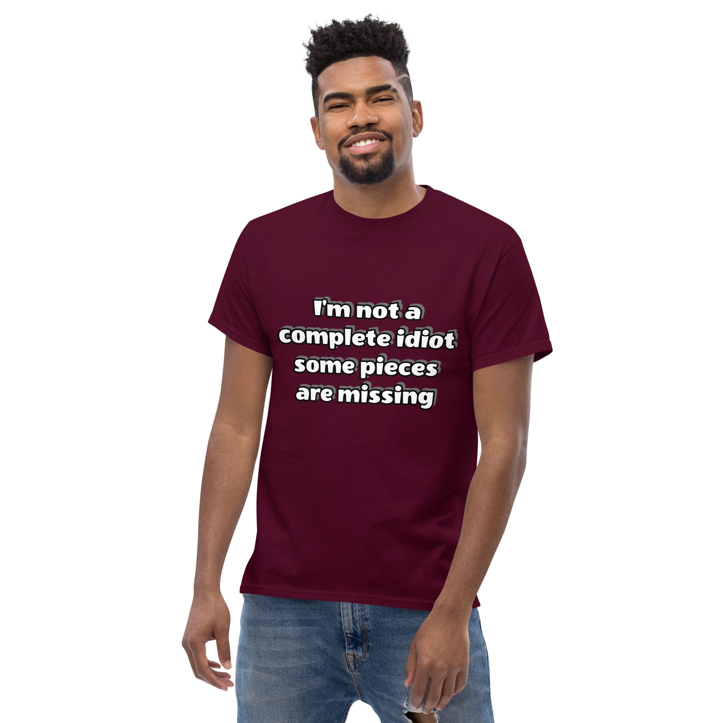 Men with maroon t-shirt with text “I’m not a complete idiot, some pieces are missing”