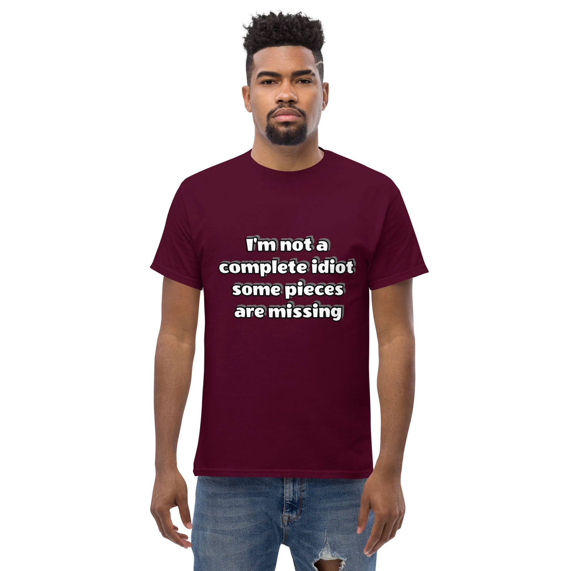 Men with maroon t-shirt with text “I’m not a complete idiot, some pieces are missing”