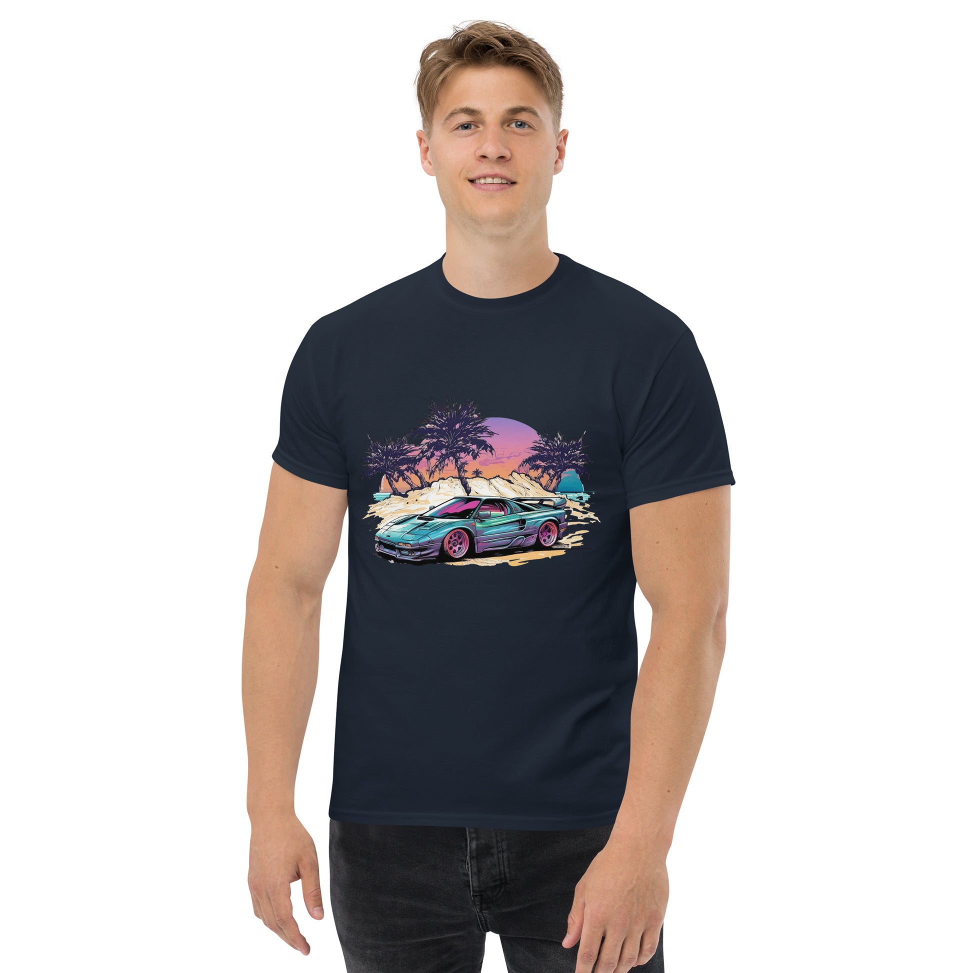 man with navy blue t-shirt with picture of vintage car in front of palm trees 