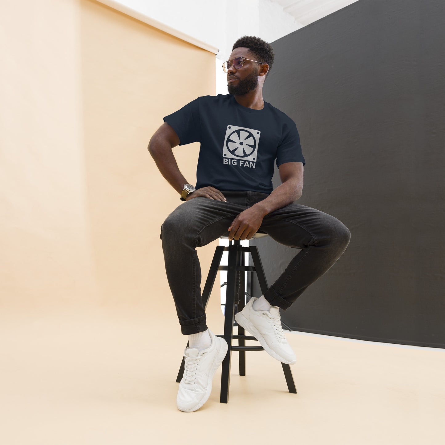 Man with dark navy blue t-shirt with image of a big computer fan and the text "BIG FAN"