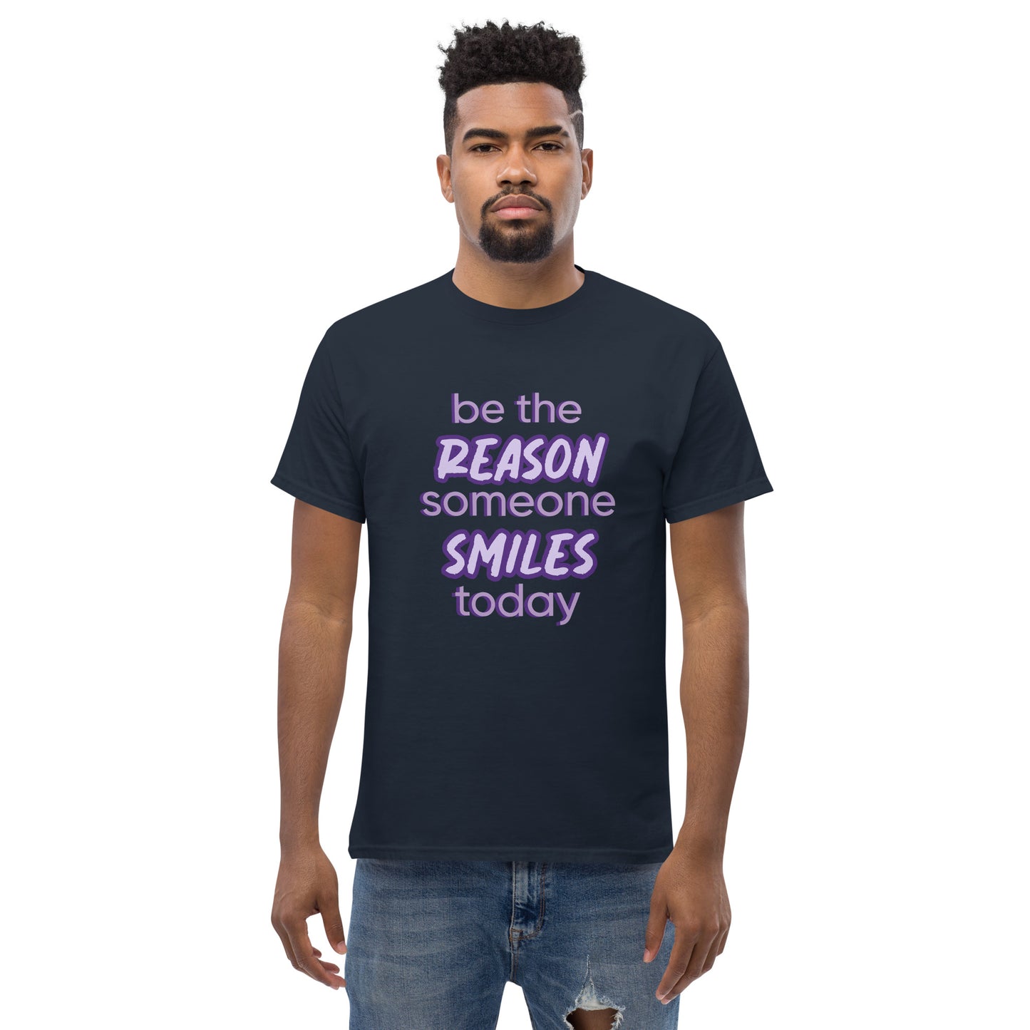 Men with navy T-shirt and the quote "be the reason someone smiles today" in purple on it.