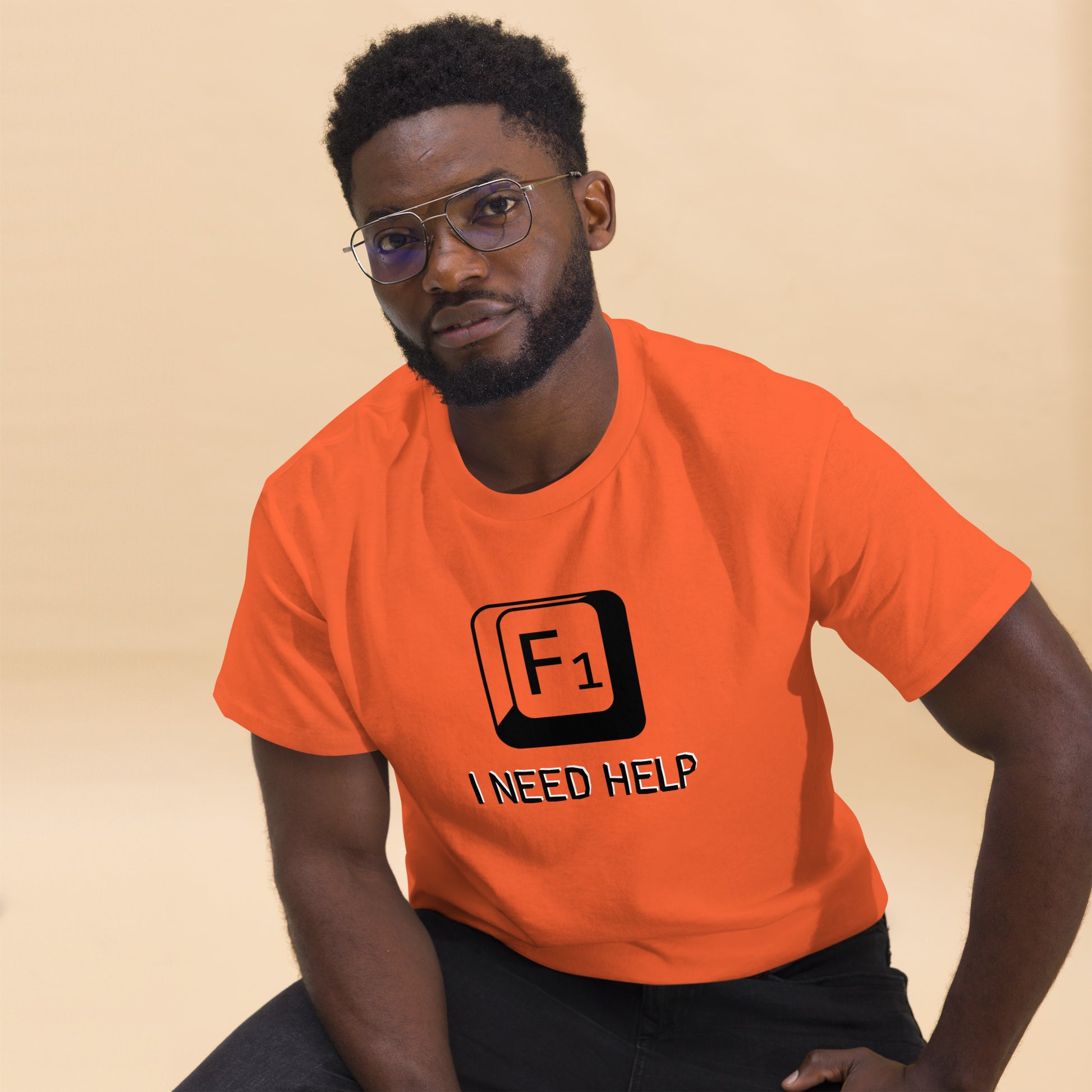 Men with Orange T-shirt and a picture of F1 key with text "I need help"