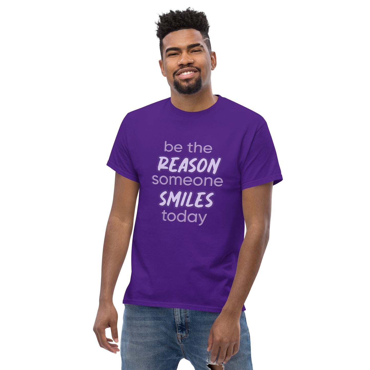 Men with purple T-shirt and the quote "be the reason someone smiles today" in purple on it. 