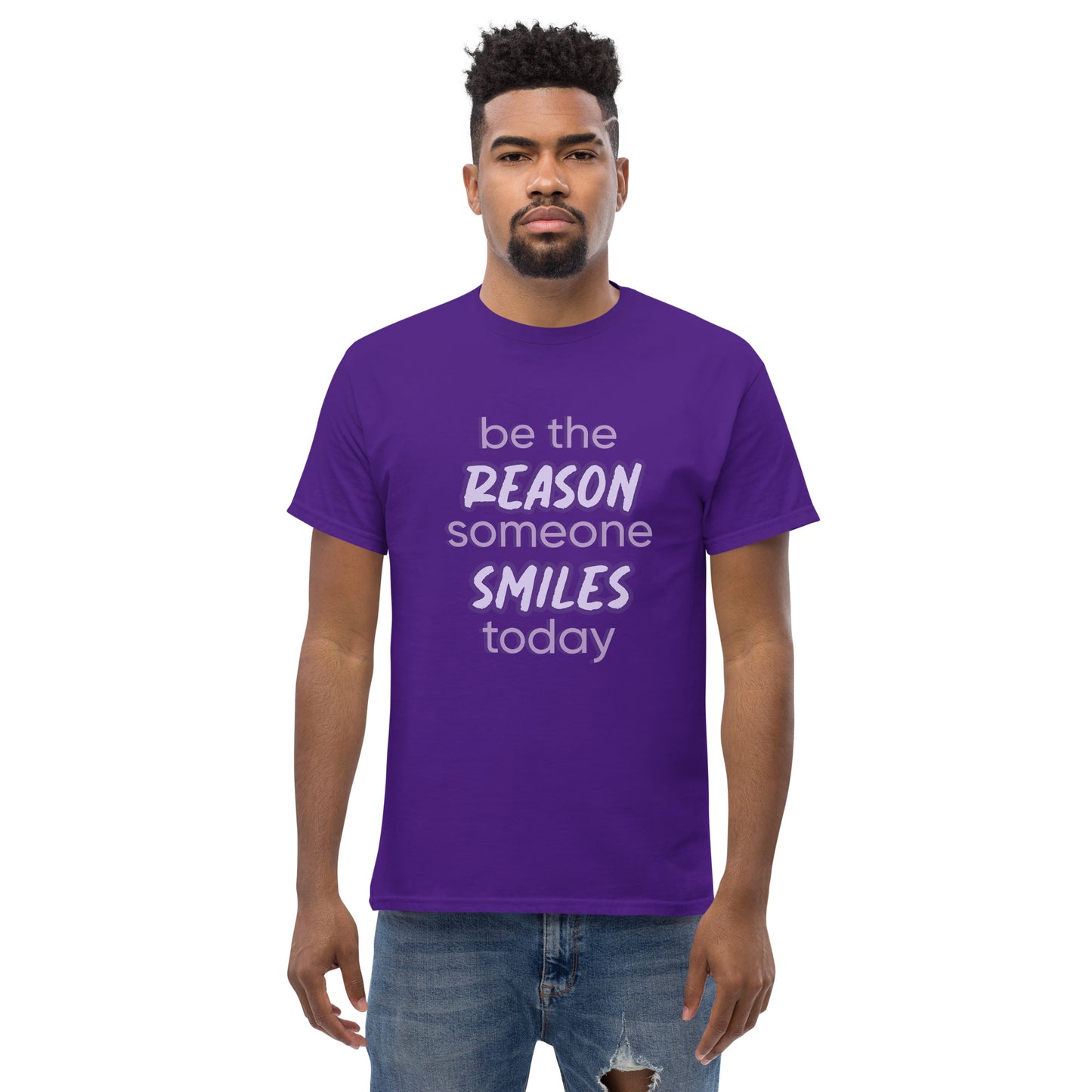 Men with purple T-shirt and the quote "be the reason someone smiles today" in purple on it.