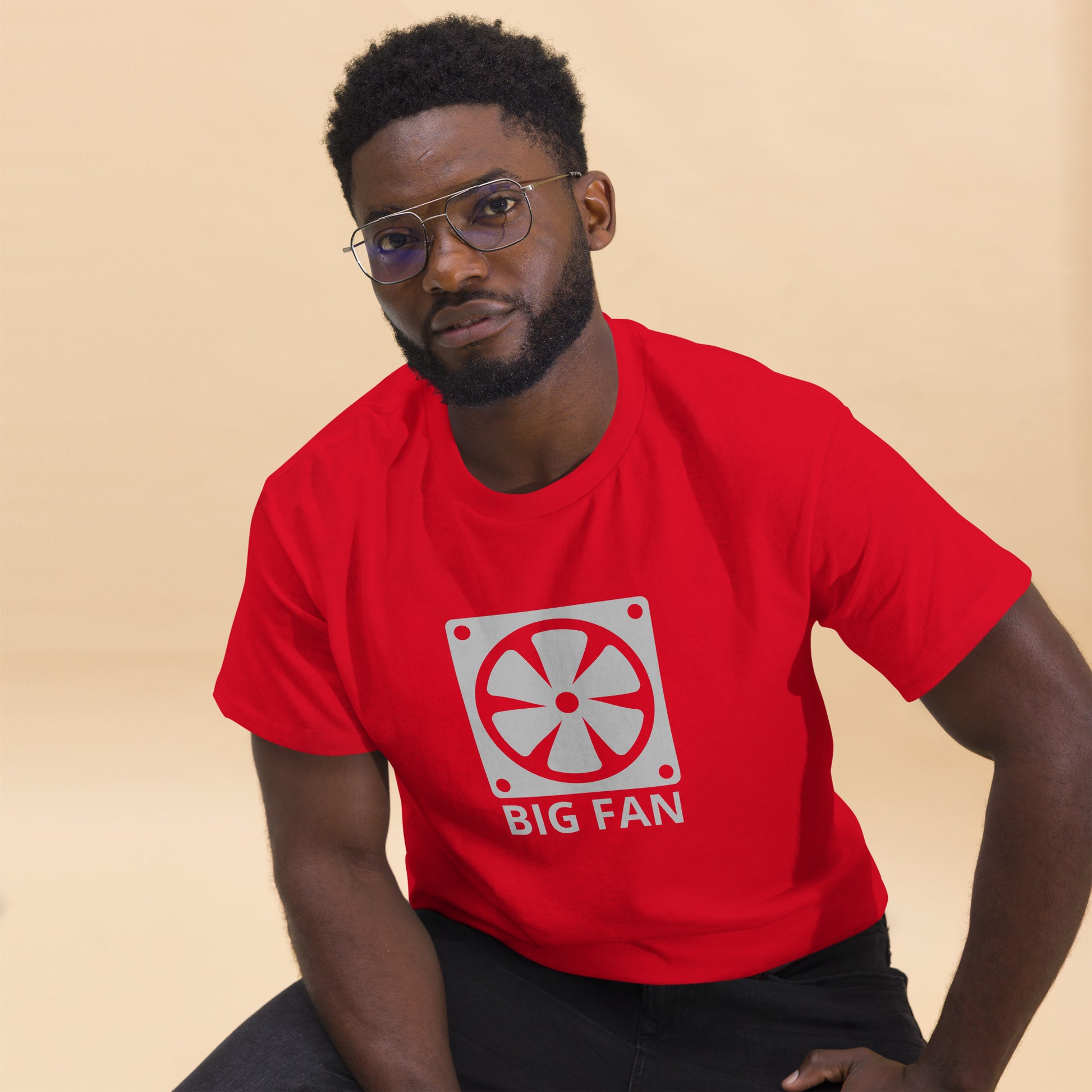 Man with red t-shirt with image of a big computer fan and the text "BIG FAN"