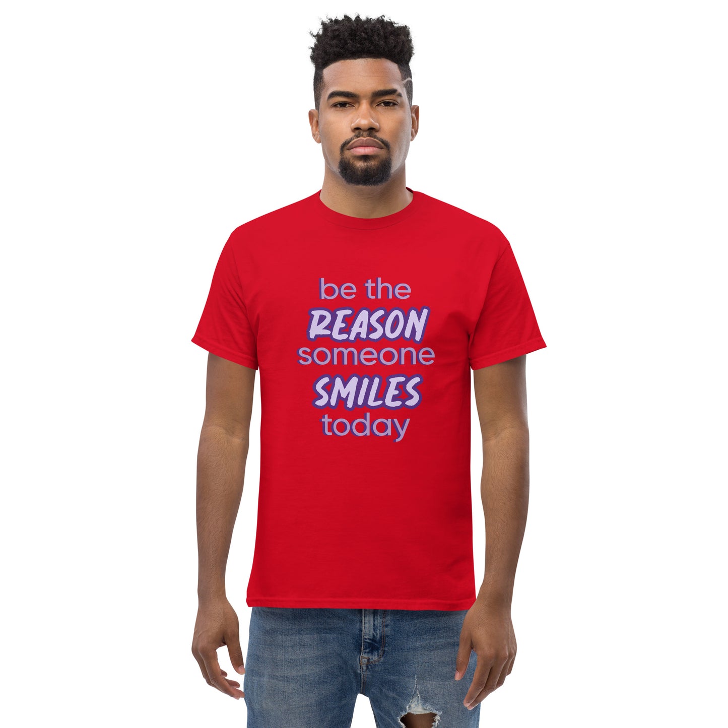 Men with red T-shirt and the quote "be the reason someone smiles today" in purple on it. 
