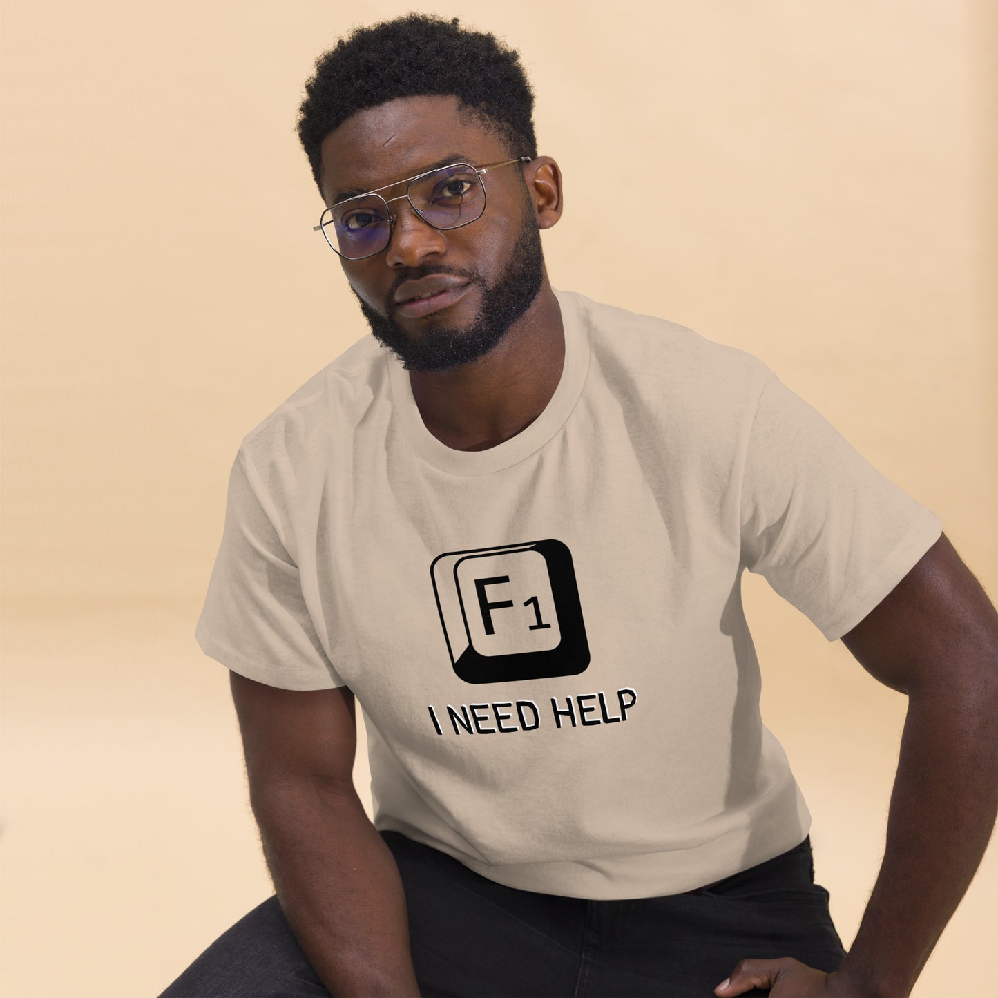 Men with Sand T-shirt and a picture of F1 key with text "I need help"