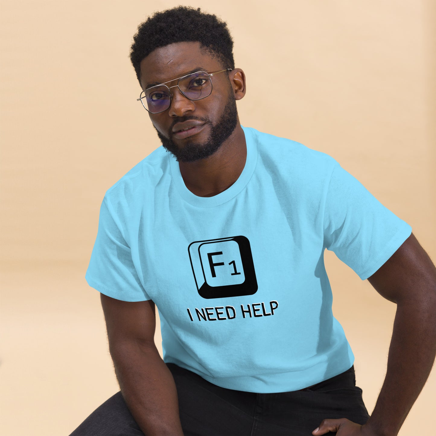 Men with Sky blue T-shirt and a picture of F1 key with text "I need help"