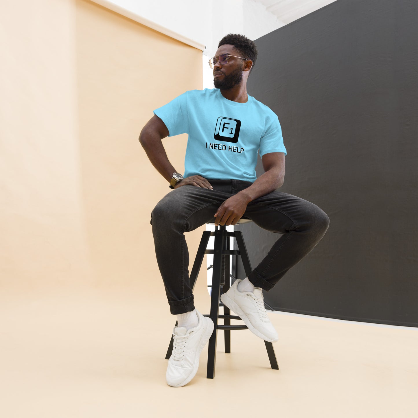 Men with Sky blue T-shirt and a picture of F1 key with text "I need help"