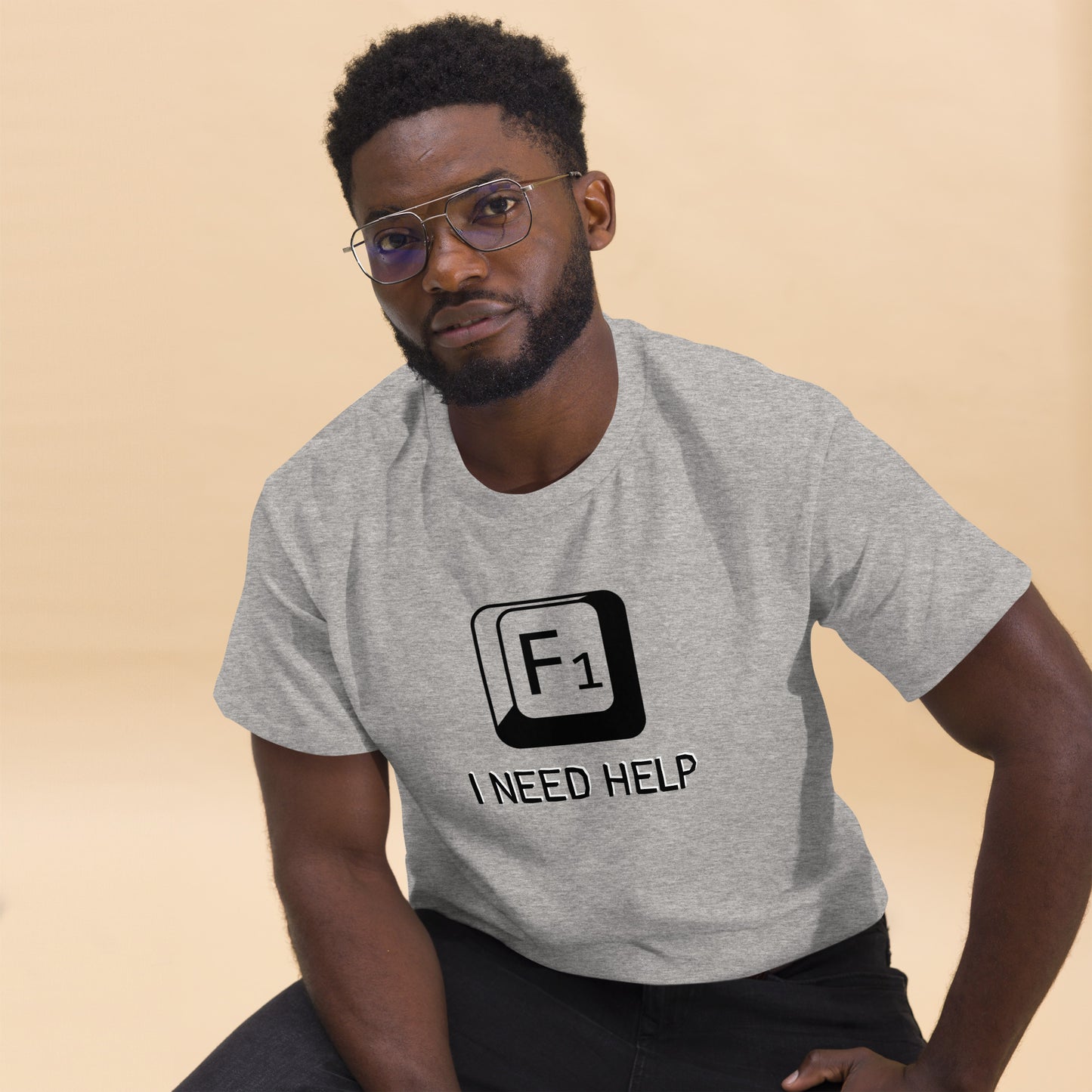 Men with Sport grey T-shirt and a picture of F1 key with text "I need help"