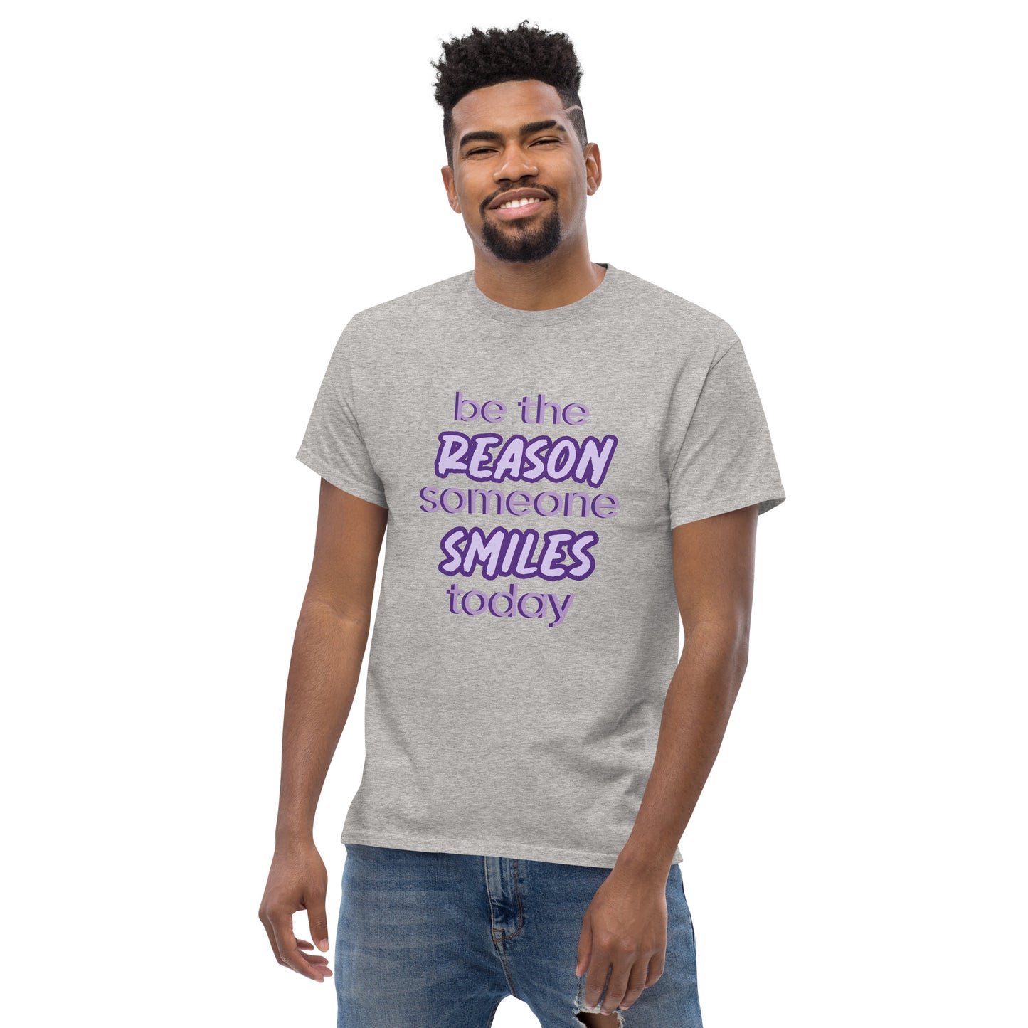 Men with sport grey T-shirt and the quote "be the reason someone smiles today" in purple on it.