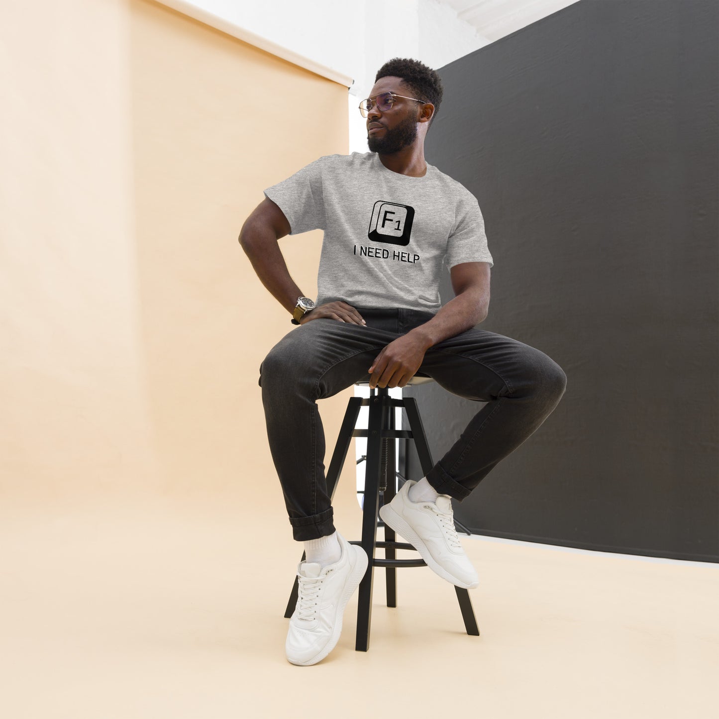 Men with Sport grey T-shirt and a picture of F1 key with text "I need help"