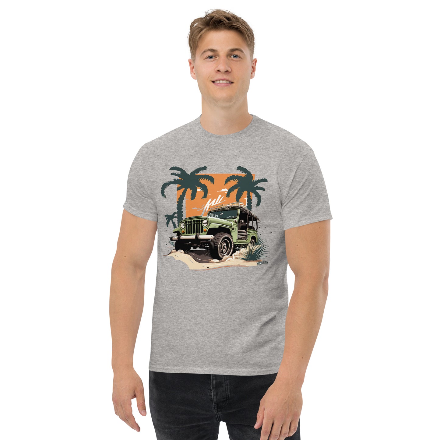 man with grey t-shirt with picture of jeep in front of palm trees