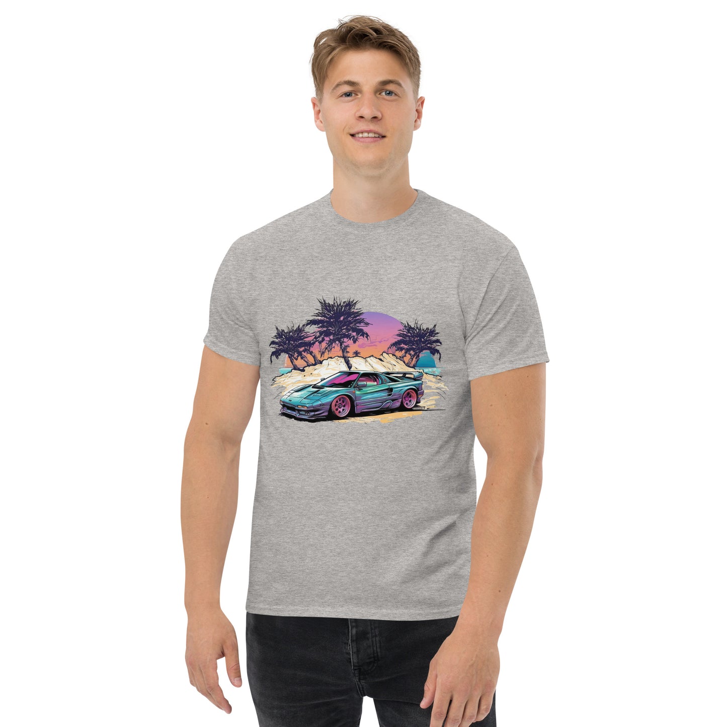man with grey t-shirt with picture of vintage car in front of palm trees