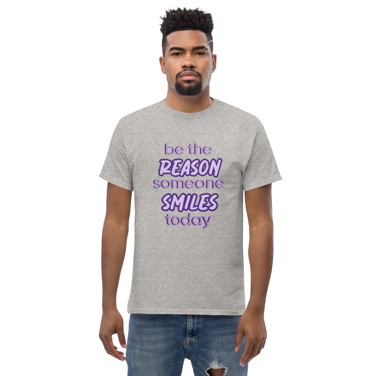 Men with sport grey T-shirt and the quote "be the reason someone smiles today" in purple on it. 