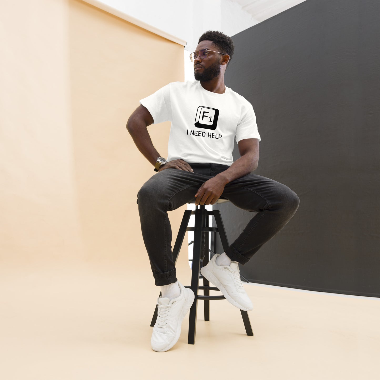Men with white T-shirt and a picture of F1 key with text "I need help"