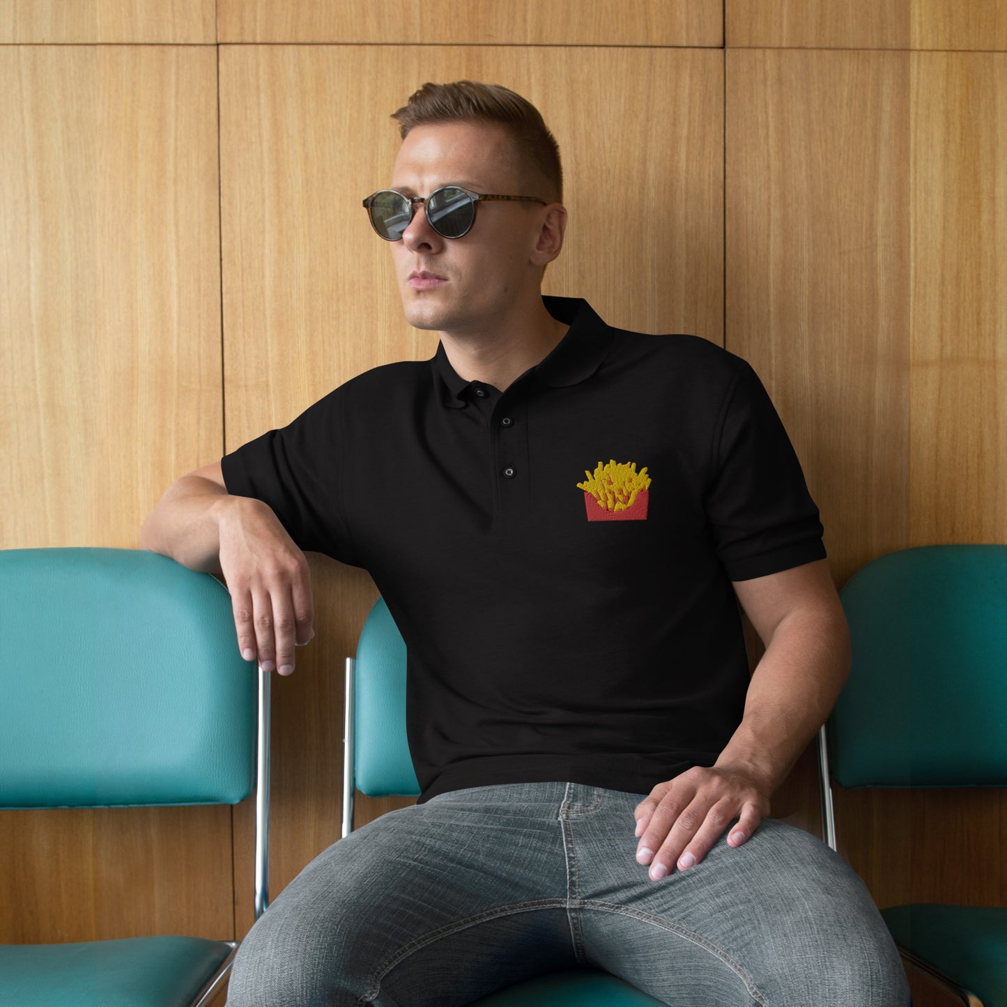 Man with black polo with picture of fries
