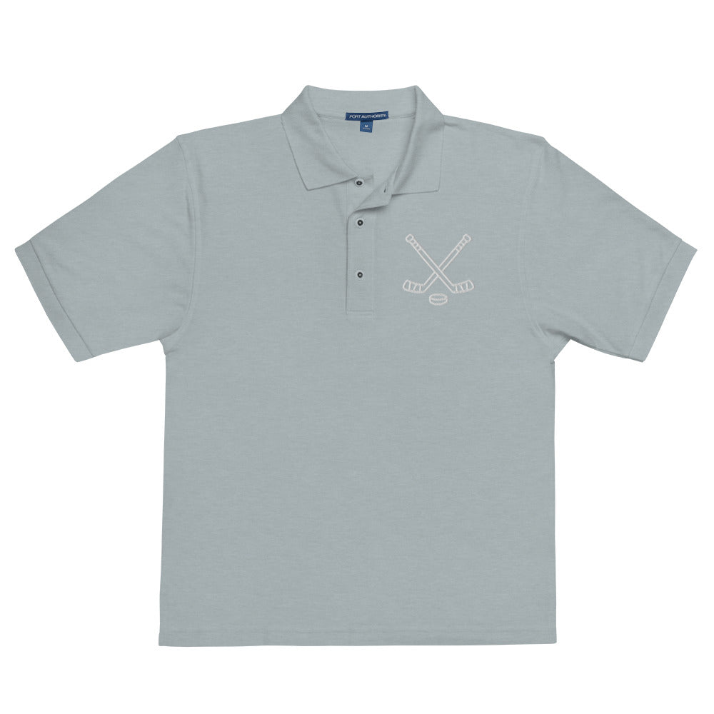 Cool heather poloshirt with print of hockeysticks and puk