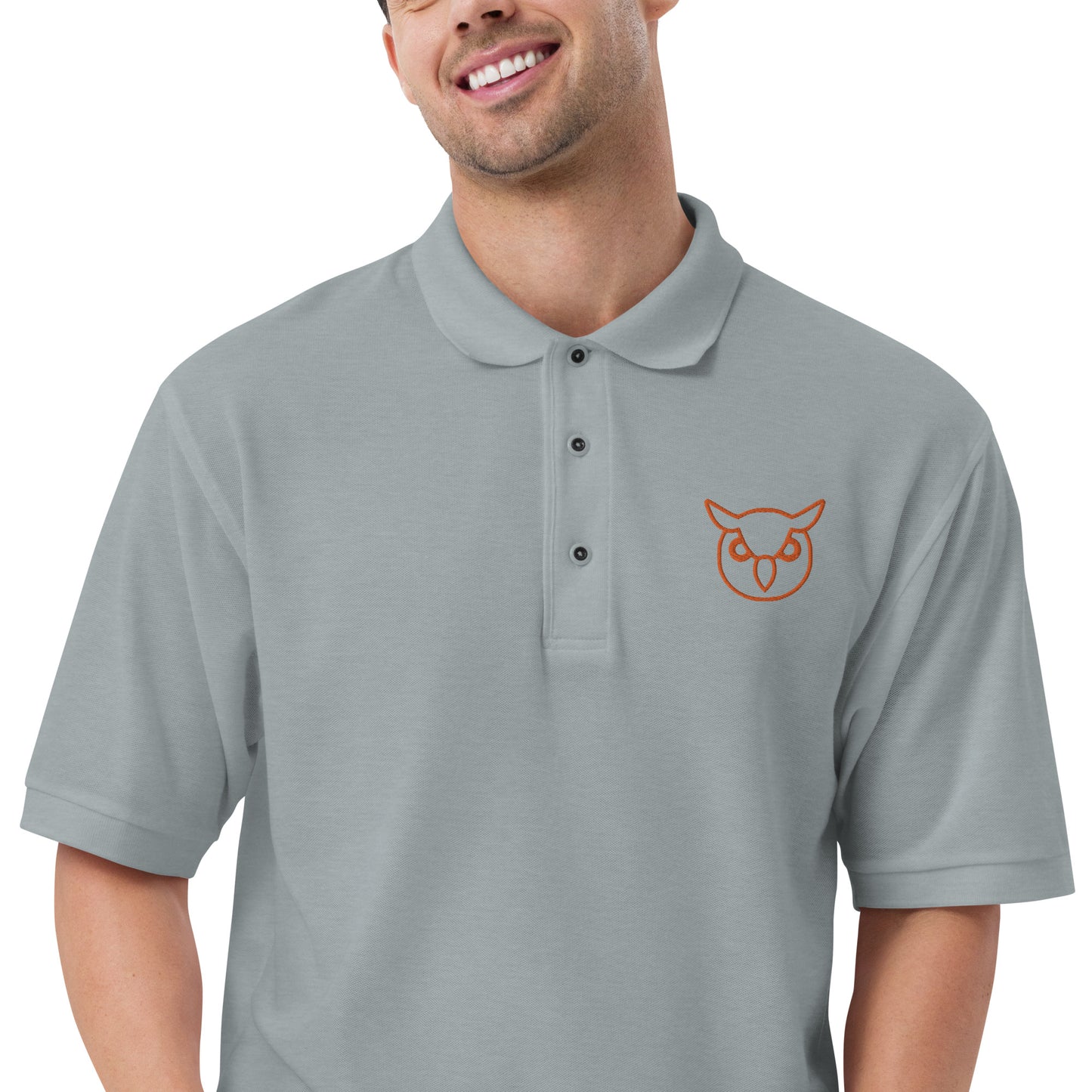 Men with heather poloshirt with on front a owl in brown embroidered