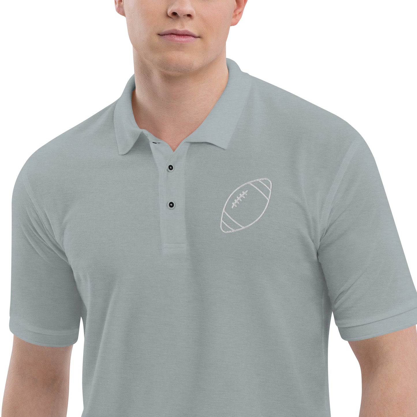 men with grey polo with football