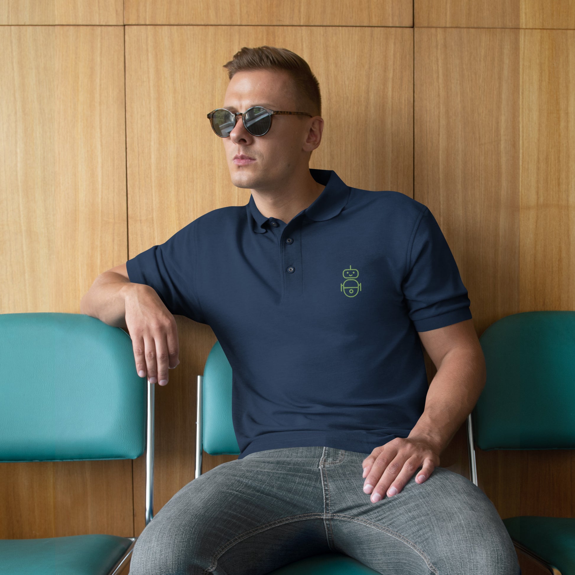 Men with navy polo and in green it Android logo