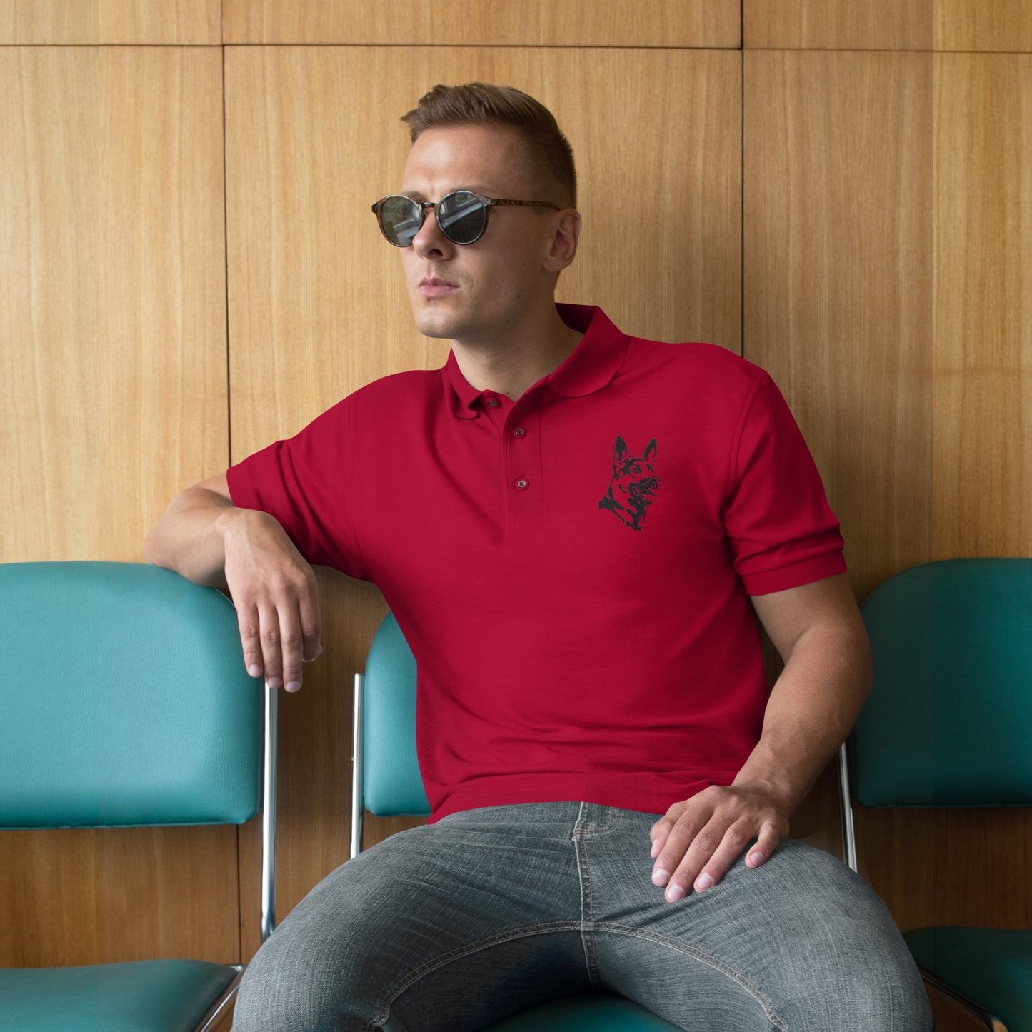 Men with red polo with German shepherd