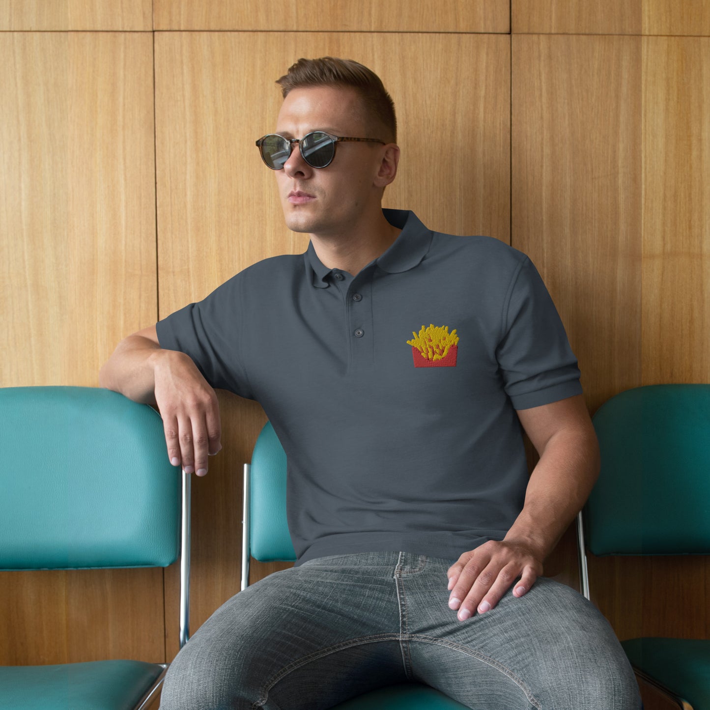 Man with grey polo with picture of fries