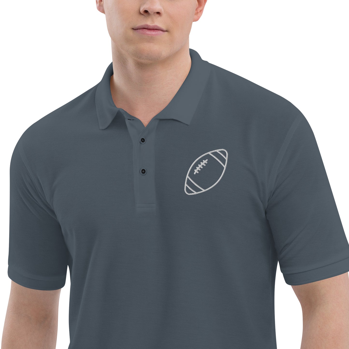 men with grey polo with football