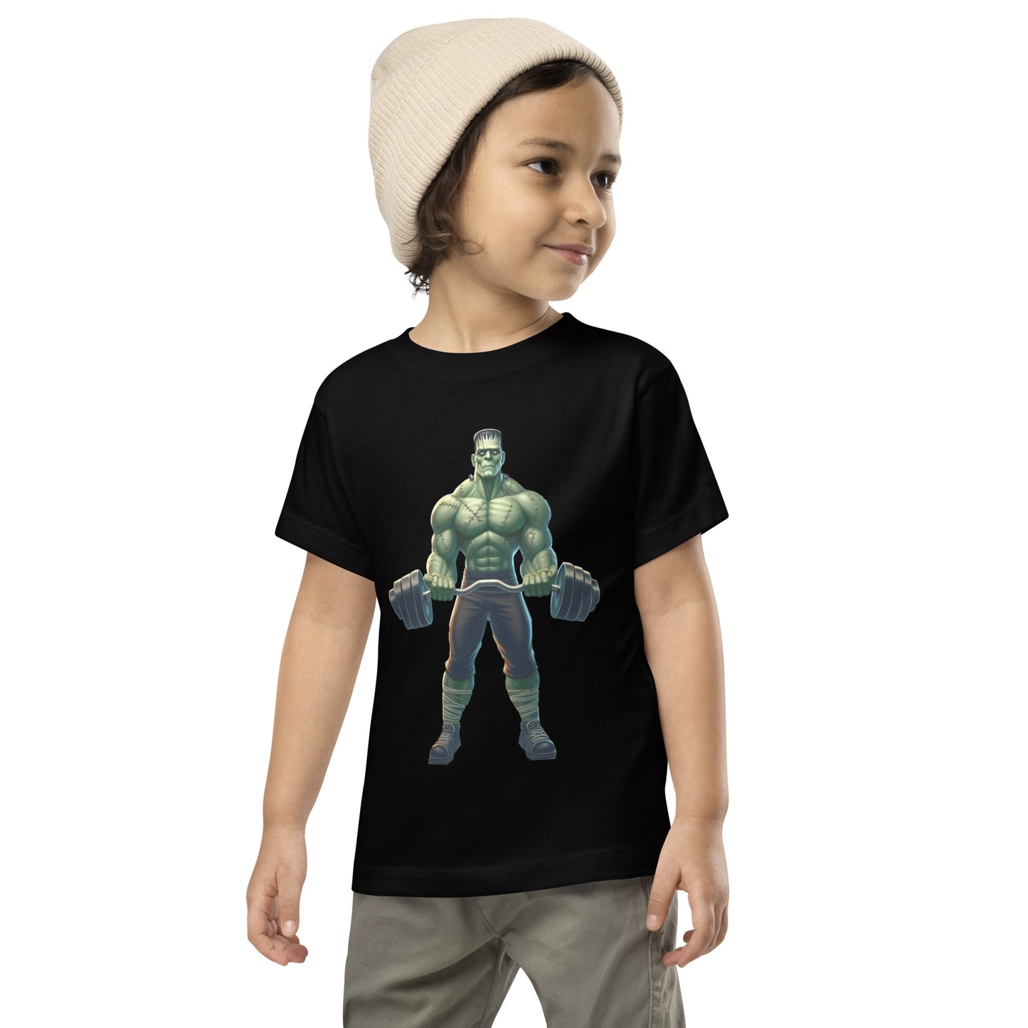 Toddler with black T-shirt with a print of a bodybuilder