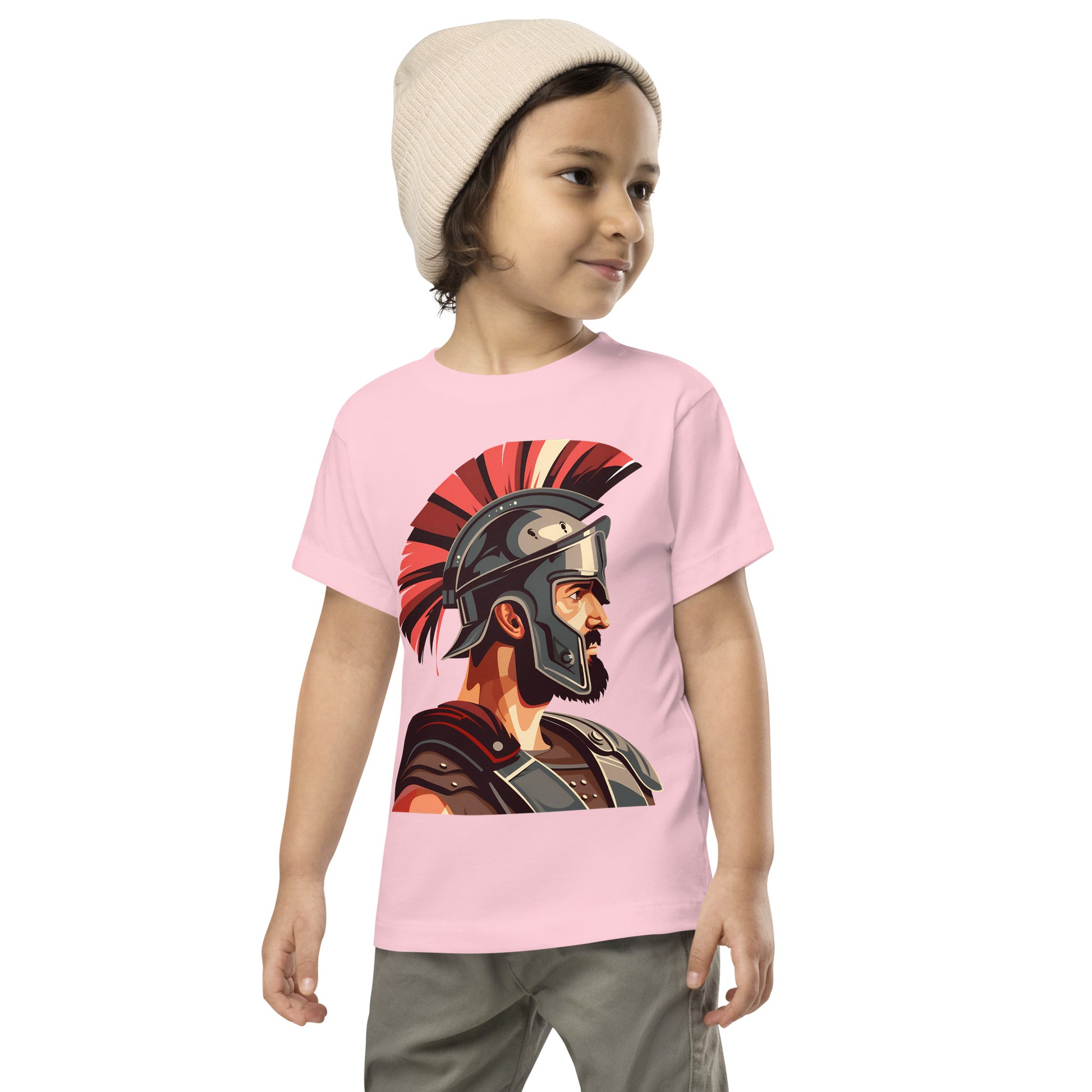 Toddler with a pink T-shirt with a print of a warrior